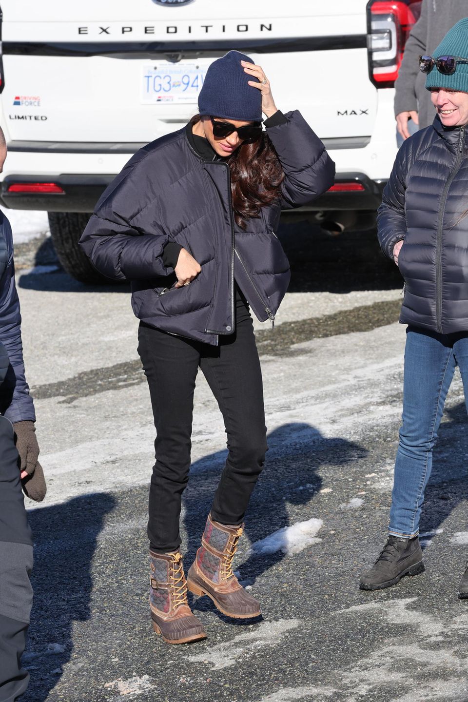 First light, then dark: On the second day in Vancouver, Meghan shows her versatile side. 