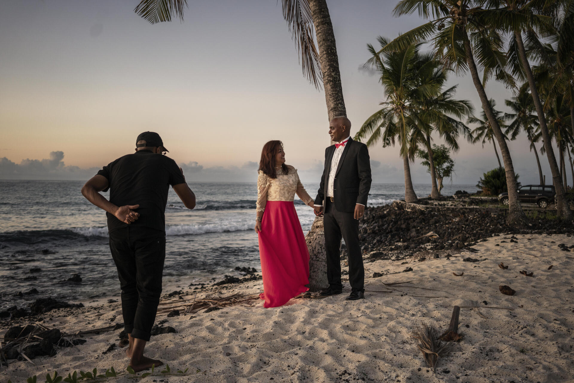 A couple takes wedding photos along Sada Beach, where the new Galawa Hotel is being built.