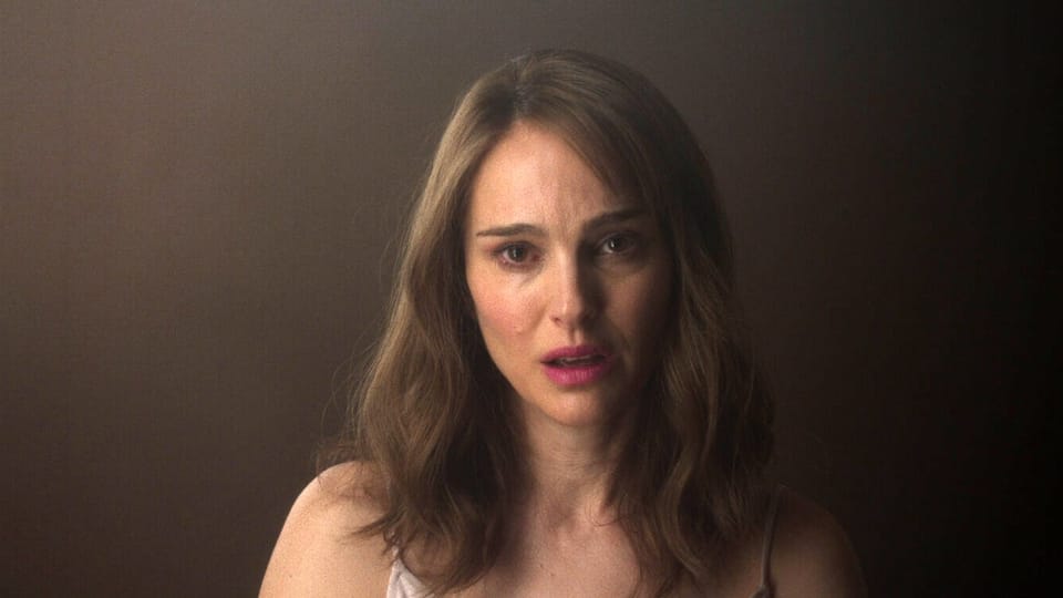 Elizabeth (Natalie Portman) looks into the mirror as she tries to imitate her study subject's lisp.