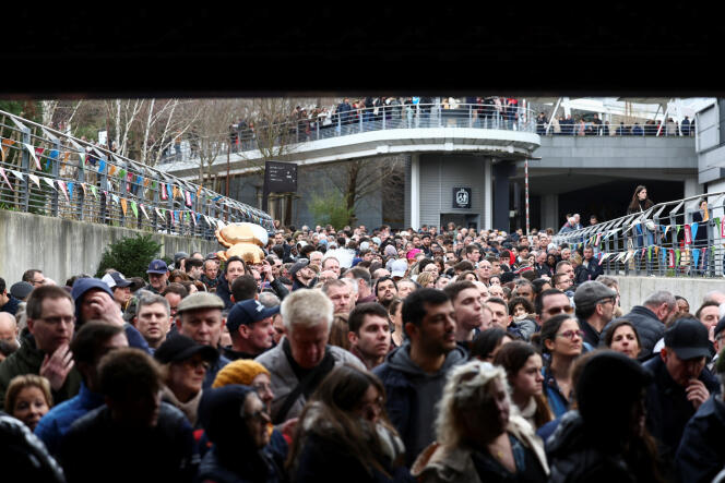 People queue at the Porte de Versailles exhibition center on the day of President Emmanuel Macron's visit to the Salon International de l'Agriculture during its inauguration, in Paris, February 24, 2024.