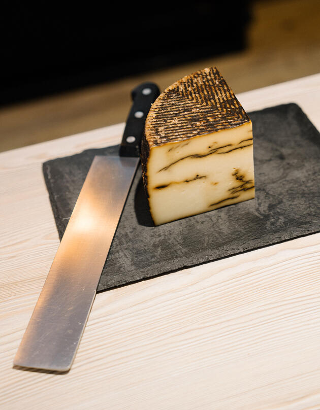 A sheep's cheese infused with black garlic from the Gambetta cheese dairy, in Biarritz, February 17, 2024.