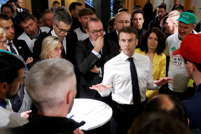 President Emmanuel Macron during a discussion with French farmers at the Porte de Versailles exhibition center, on the opening day of the 60th International Agricultural Show, in Paris, February 24, 2024.