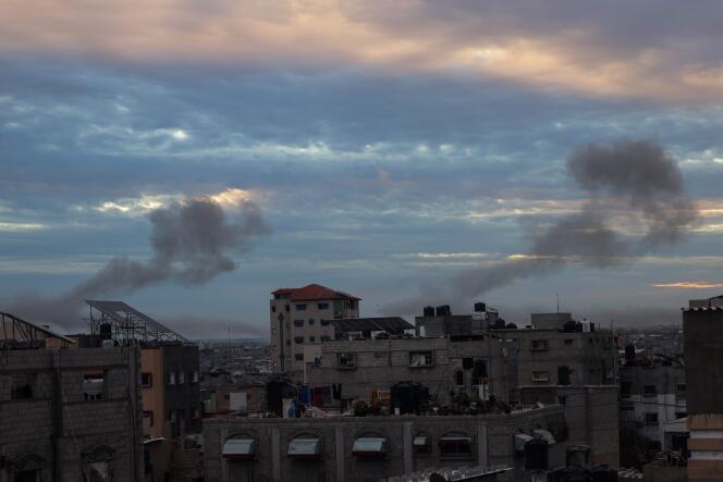 Plumes of smoke rise above Rafah, after Israeli strikes, February 13, 2024.