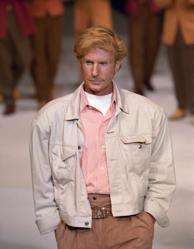 French fashion designer Claude Montana greets the audience at the end of his spring-summer ready-to-wear show, October 21, 1990.