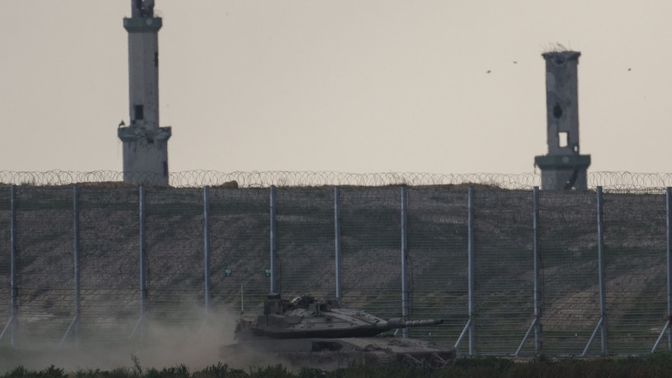Israeli tank moves near the Israel-Gaza border.
