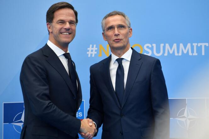 Dutchman Mark Rutte (left) shakes hands with NATO Secretary General Jens Stoltenberg in Brussels, July 11, 2018.