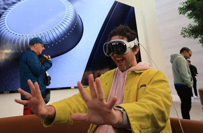 A customer tests a tutorial during the Apple Vision Pro launch at Apple's The Grove store in Los Angeles, California on February 2, 2024.