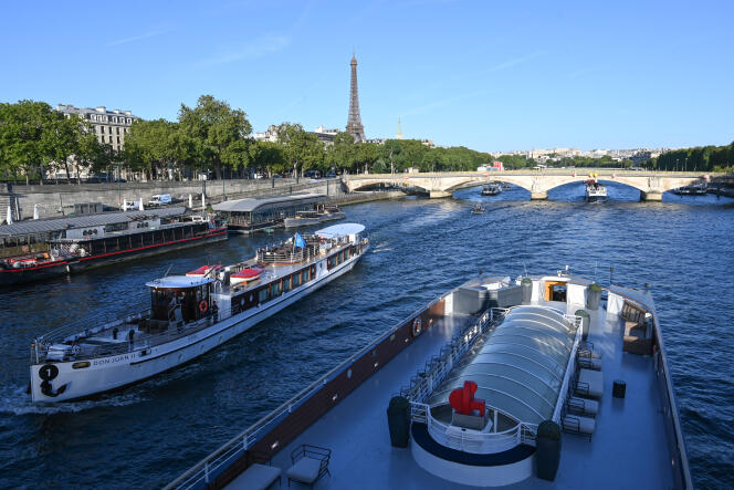 Barges on the Seine during a first technical test, July 17, 2023, in Paris, in preparation for the opening ceremony of the Games.
