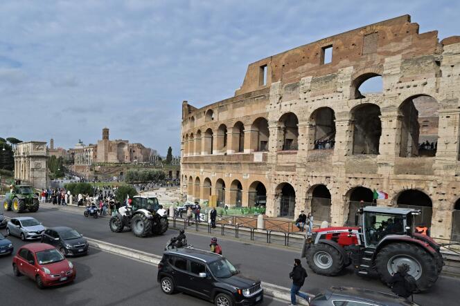 Tractors parade in front of the Colosseum, in Rome, Friday February 9, 2024.
