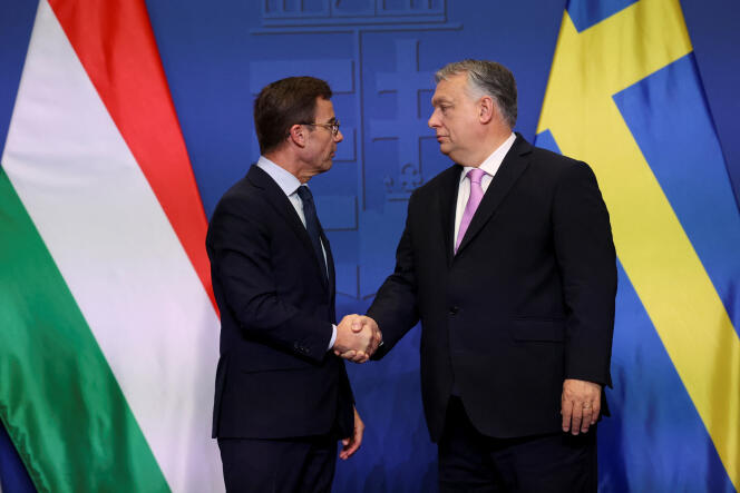 Swedish Prime Minister, Ulf Kristersson, and Hungarian Prime Minister, Viktor Orban, shake hands during a joint press conference in Budapest, Hungary, February 23, 2024. 