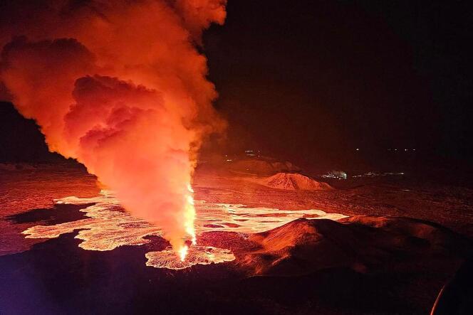 Smoke and lava rise from a new fissure during a new volcanic eruption on the outskirts of the evacuated town of Grindavik, western Iceland, February 8, 2024.