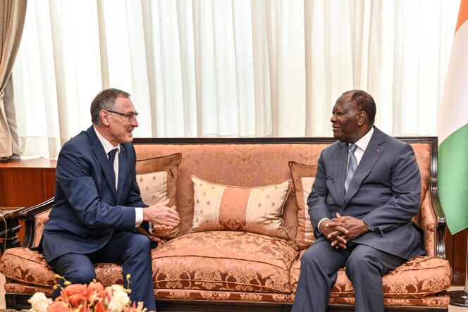 Emmanuel Macron's personal envoy for Africa, Jean-Marie Bockel, and Ivorian President Alassane Ouattara, in Abidjan, February 21, 2024.