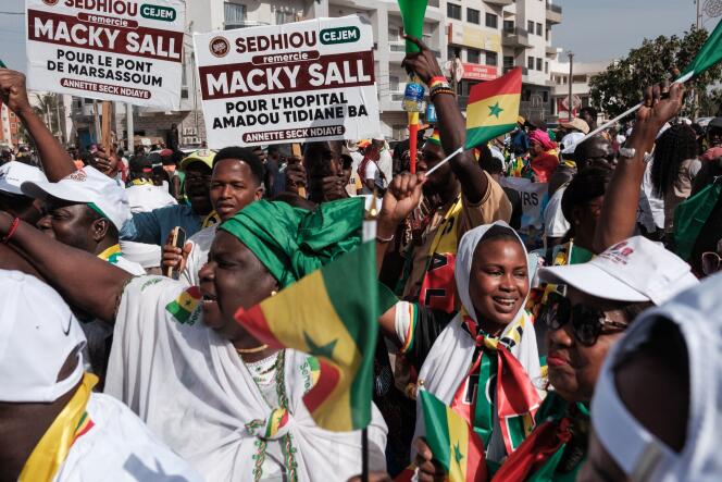 Demonstrators support Senegalese President Macky Sall in Dakar on February 24, 2024. 