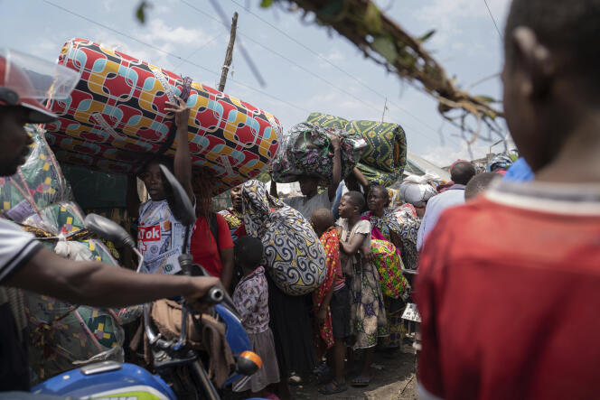 Thousands of people flee clashes between the Congolese army and M23 rebels who reach the entrance to the city of Goma, in eastern DRC, on February 7, 2024. 