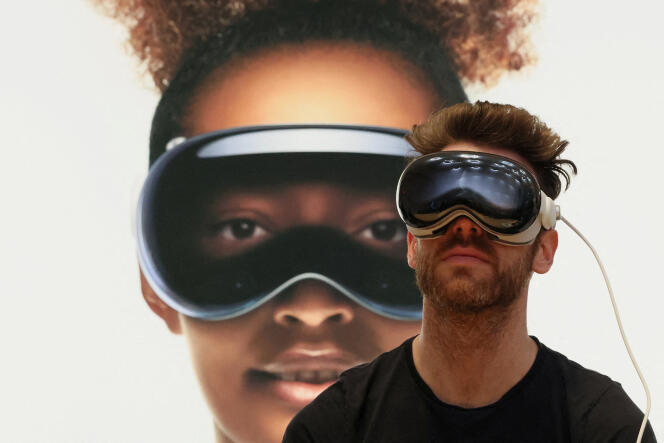 A customer tries on an Apple Vision Pro headset at an Apple store in New York on February 2, 2024.