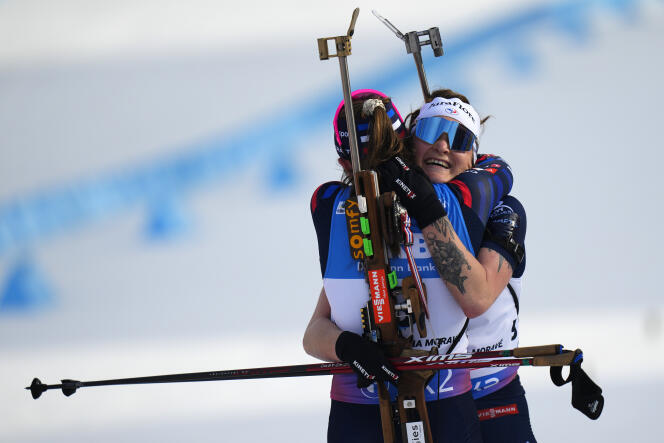 Lou Jeanmonnot congratulates Justine Braisaz-Bouchet, winner of the mass start of the biathlon world championships in Nove Mesto in the Czech Republic, February 18, 2024.