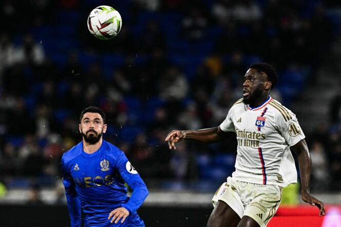 Nice's Morgan Sanson faces Lyon's Orel Mangala, scorer of the only goal of the match, at Groupama Stadium, in Decines-Charpieu, near Lyon, on February 16, 2024.