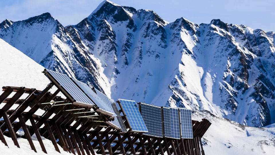 Solar panels next to the ski slope in the mountains of the municipality of Bellwald in Upper Valais.