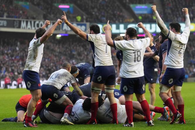 The French celebrate their victory during the last action of the match against Scotland, Saturday February 10, in Edinburgh. 