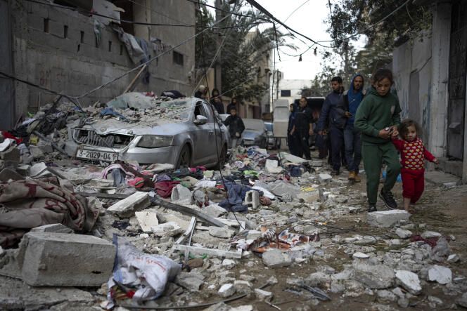 Palestinians view the damage caused by an Israeli airstrike in Rafah, Gaza Strip, Friday, February 9, 2024.