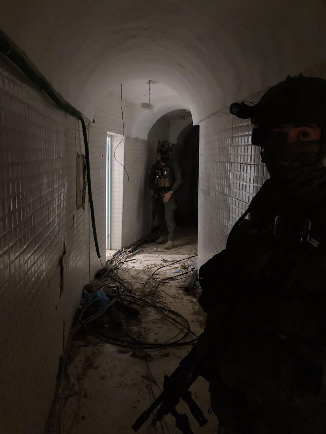 Israeli soldiers show journalists part of the tunnels they discovered, in Khan Younes, in the Gaza Strip, February 4, 2024.