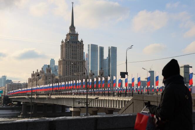 Russian flags decorate a bridge over the Moskva River on Defender of the Fatherland Day, celebrated annually on February 23, in central Moscow, Tuesday February 20. 