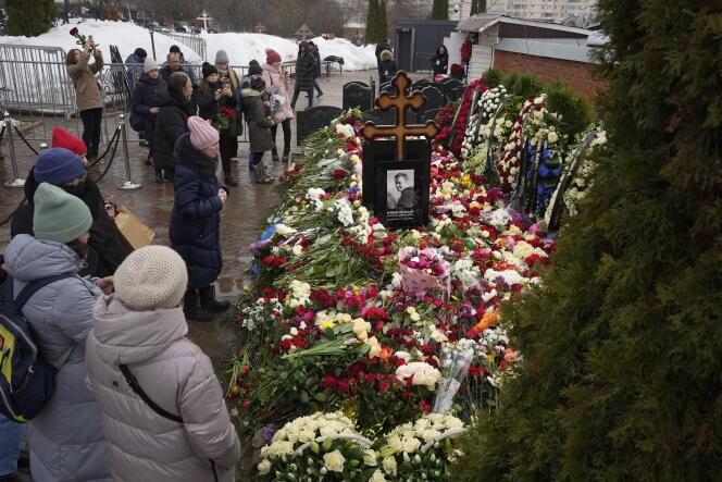Anonymous people place flowers on the grave of Alexeï Navalny on Saturday March 2, 2024.