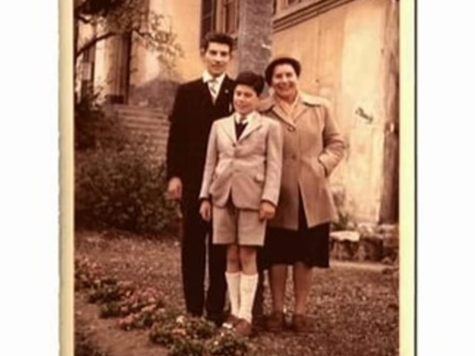 Old photo of a woman and two boys.