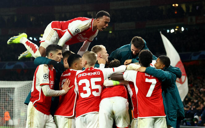 Arsenal players celebrate their qualification for the quarter-finals of the Champions League at the Emirates Stadium in London on March 12, 2024.