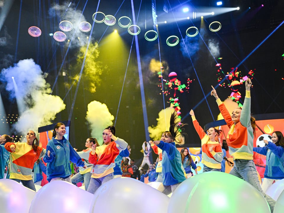Closing ceremony of the World Youth Festival, a group dances.