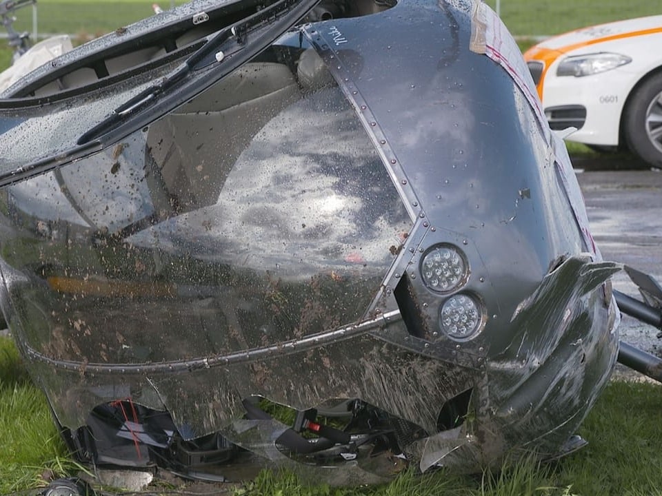 Close-up of broken helicopter from the front, smashed window.