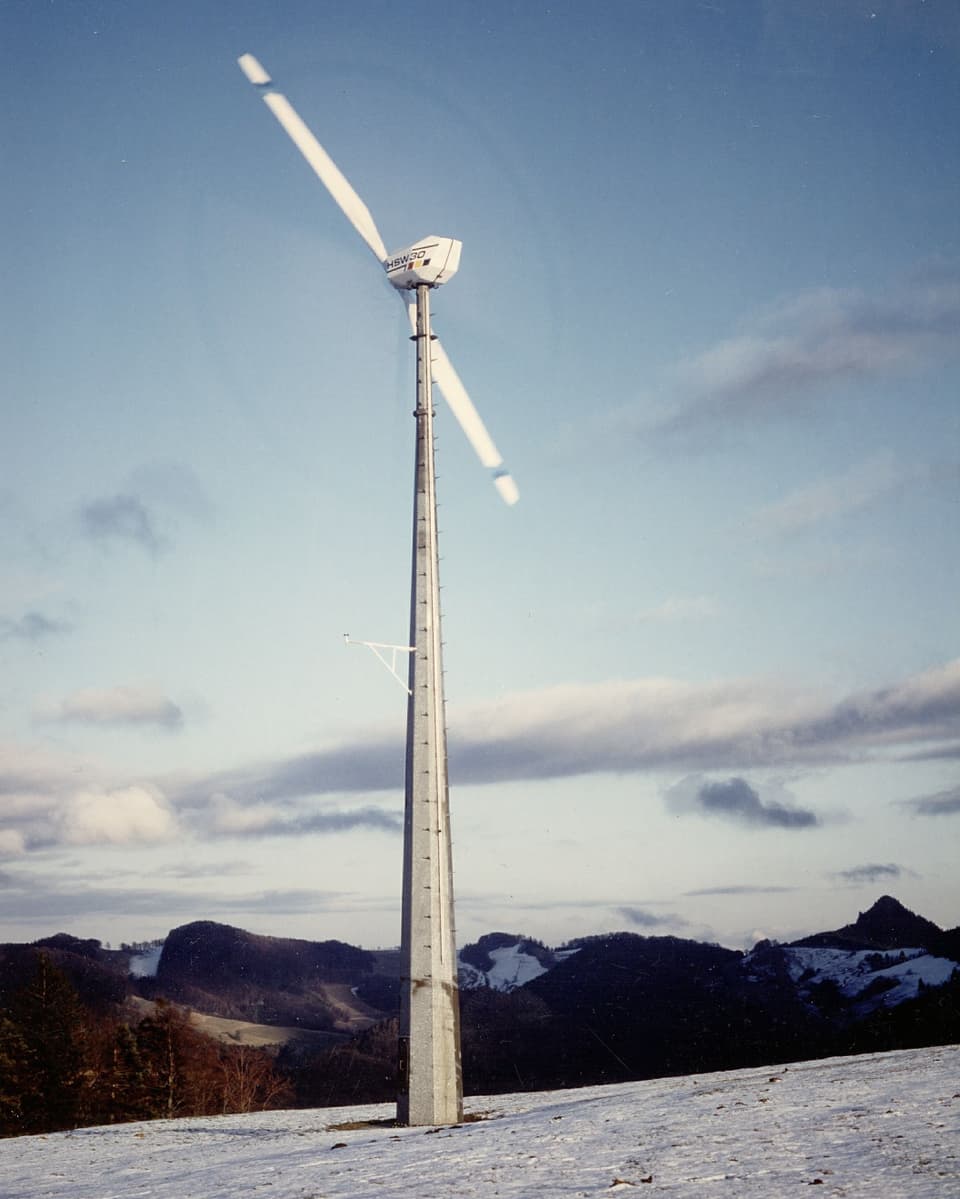 Old photo with a large wind turbine.