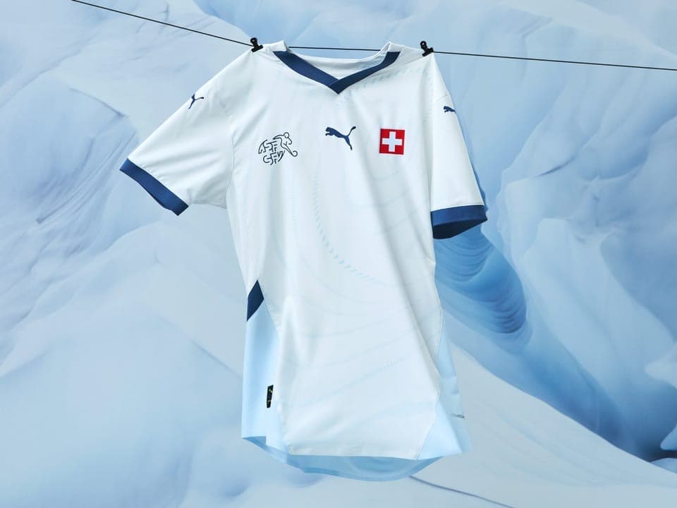 The sleeves and collar of the white away jersey receive a splash of color.