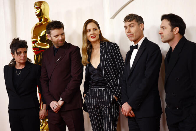 From left to right: Marie-Ange Luciani, Antoine Reinartz, Justine Triet, David Thion and Arthur Harari, during the 96th Academy Awards ceremony, in Hollywood (United States), March 10, 2024.