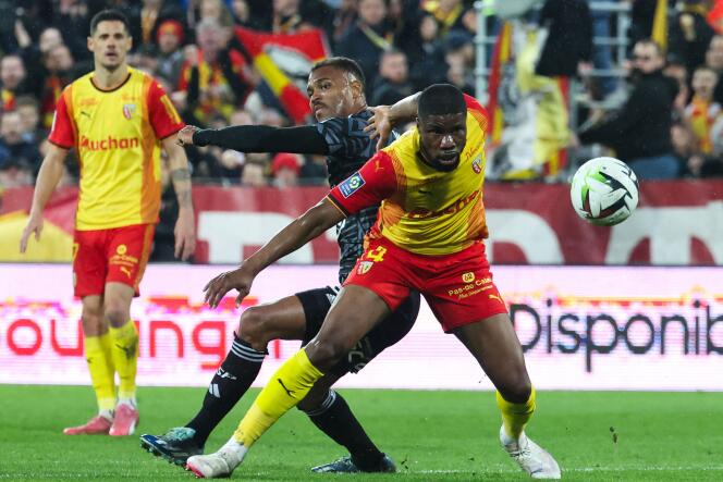 Lens defender Kevin Danso blocks Brest striker Steve Mounie, at the Stade Bollaert-Delelis in Lens, March 9, 2024.