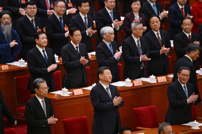 Chinese President Xi Jinping attends the opening ceremony of the Chinese People's Political Consultative Conference (CPPCC), with Chinese Premier Li Qiang and Politburo Standing Committee member Zhao Leji, at the Hall of the People, in Beijing, on March 4, 2024. 
