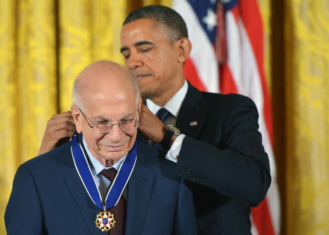 US President Barack Obama presents the Presidential Medal of Freedom to psychologist Daniel Kahneman at the White House in Washington on November 20, 2013.