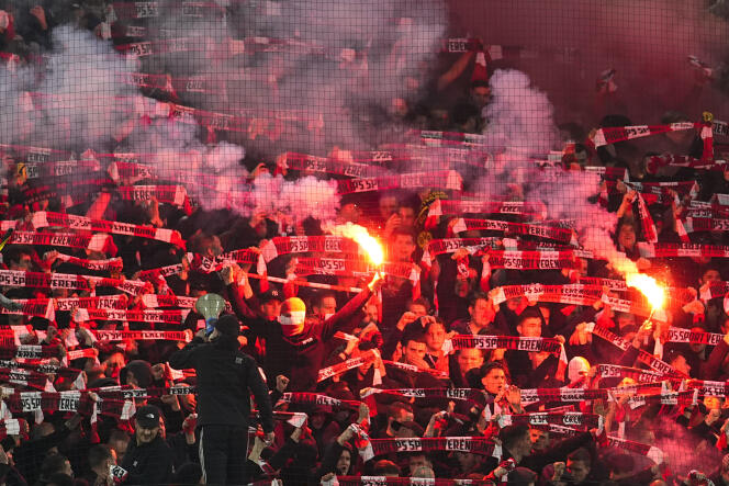Eindhoven supporters light smoke bombs before the match against Borussia Dortmund at Signal Iduna Park in Dortmund, Germany, March 13, 2024.