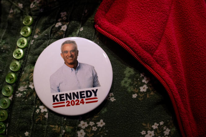 A person wears a pin supporting independent presidential candidate Robert F. Kennedy Jr. during a voters' rally at the St. Cecilia Music Center in Grand Rapids, Michigan, February 10, 2024.