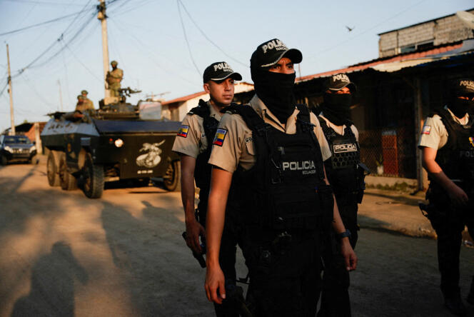 Police officers participate in a joint army and police operation in the Socio Vivienda neighborhood, Guayaquil, Ecuador, March 26, 2024.