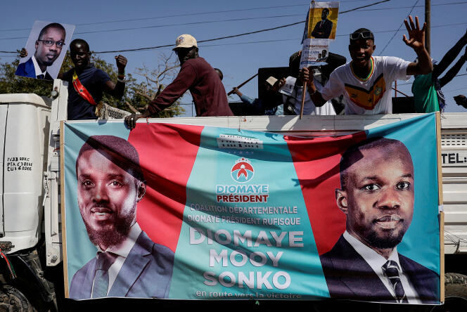 Supporters of opposition leader Ousmane Sonko, then imprisoned, support presidential candidate Bassirou Diomaye Faye, in Dakar, March 12, 2024.