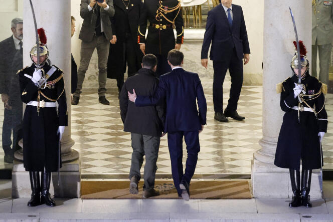 Emmanuel Macron welcomes Ukrainian President Volodymyr Zelensky upon his arrival at the Elysée on February 16, 2024.