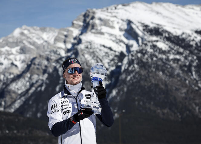 Norwegian Johannes Thingnes Boe with his crystal globe after winning his fifth biathlon world cup, in Canmore (Canada), March 16, 2024.