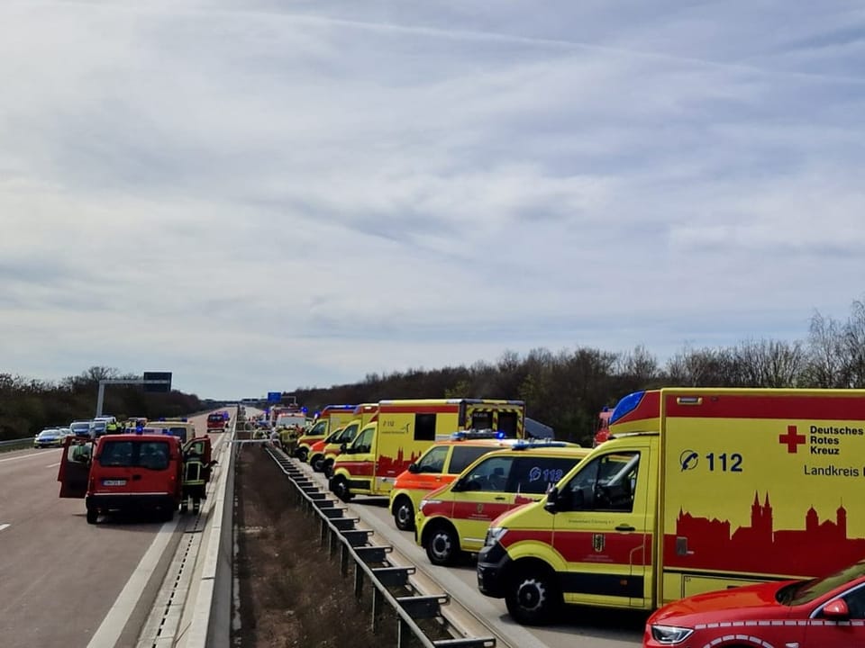 Ambulances are lined up on the highway.