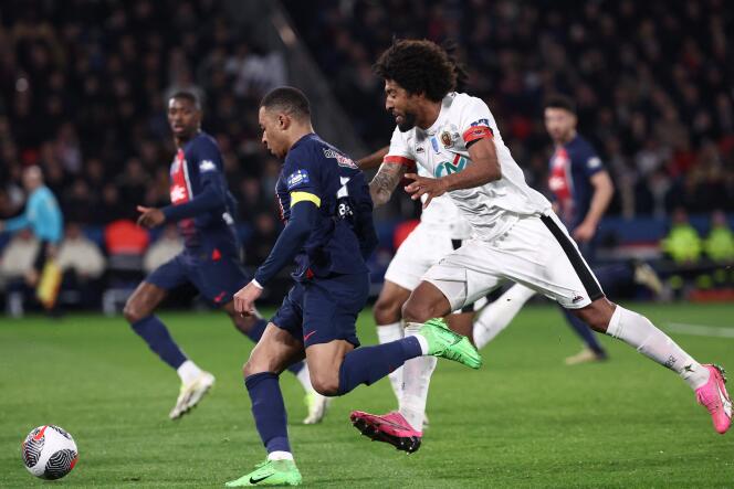 Kylian Mbappé breaks free from Nice defender Dante in the quarter-finals of the Coupe de France, at the Parc des Princes, in Paris, March 13, 2024.