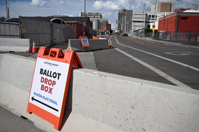 Signs direct voters to ballot drop boxes, on the eve of the March 19 Democratic and Republican Party primaries, in Phoenix, Arizona, March 18, 2024.