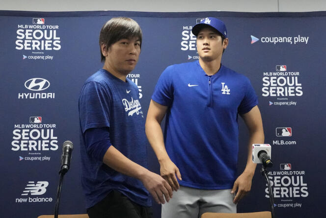Japanese baseball star and Los Angeles Dodgers player Shohei Ohtani (R) and his interpreter, Ippei Mizuhara, before training at the Gocheok Sky Dome in Seoul on March 16, 2024.