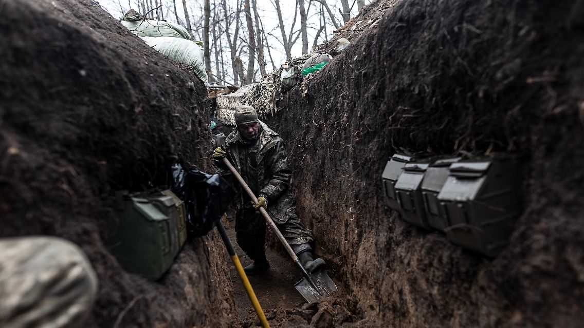 This photo from the front was taken on Sunday.  A Ukrainian soldier digs a trench at his infantry position in the Kharkiv region.