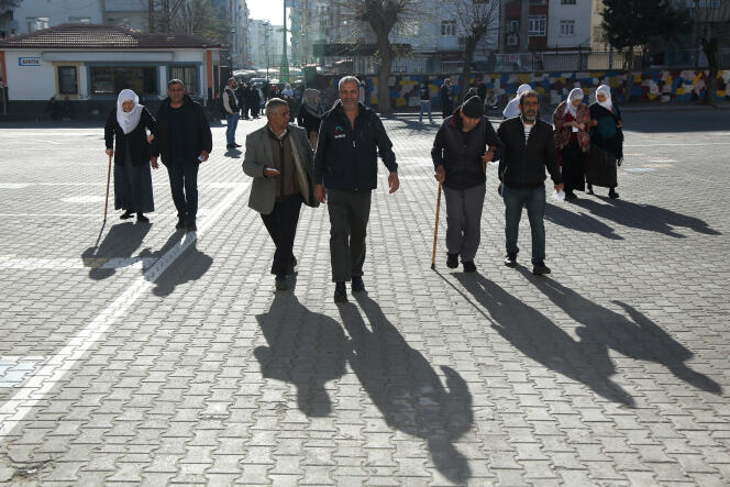 People arrive at a polling station during local elections in Diyarbakir, Turkey, March 31, 2024.