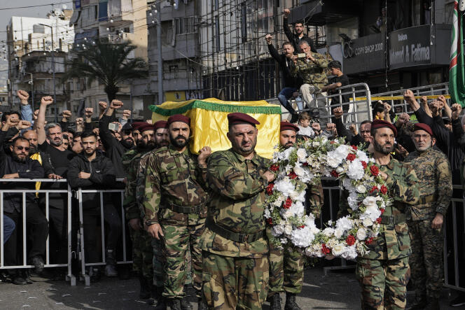 Hezbollah fighters carry the coffin of Mostafa Ahmad Makki, killed by an Israeli strike in Syria on Friday March 29, during his funeral procession in the southern suburbs of Beirut, March 30, 2023.